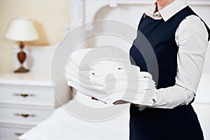 Hotel services. housekeeping maid with linen
