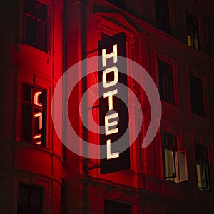 Hotel sign in neon light at night