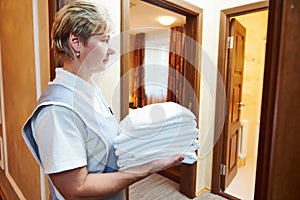 Hotel staff at room cleaning and housekeeping