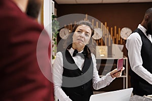 Hotel staff verifying passport