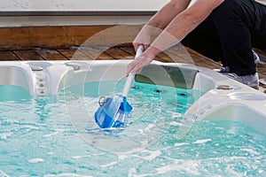 Hotel staff worker cleaning the hot tub