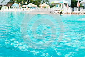 Hotel swimming pool with clear blue water. Summer.