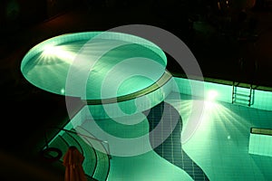 Hotel swimming pool by night
