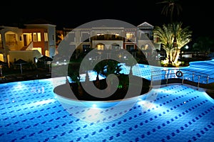 Hotel swimming pool by night