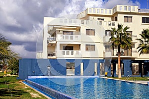 Hotel, swimming pool and palm trees, Cyprus.