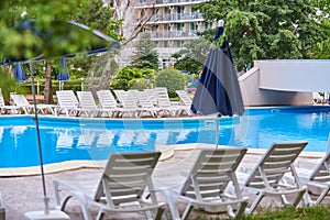 Hotel swimming pool umbrella and chairs