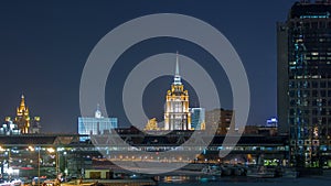 Hotel Ukraine and pedastrian bridge timelapse, landmark near historic center of Moscow. Cityscape in snowy winter