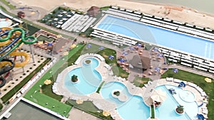 Hotel view of the pool and the sea. Scene. View of swimming pool with sea and beach in luxury hotel and resort for