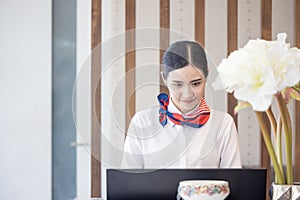 Hotel women working as professional receptionists behind the counter photo
