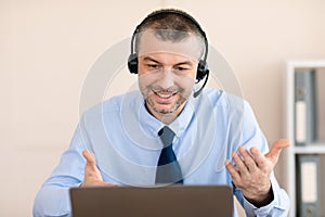 Hotline Operator Talking With Client Making Video Call In Office