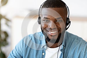 Hotline Support Service. Portrait Of Smiling African Customer Service Operator In Headset