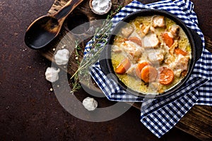 Hotpot, stew meat with vegetables in a cast-iron pot