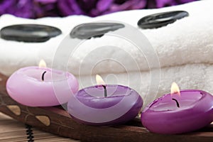 Hotstones on towel with purple candles (2)