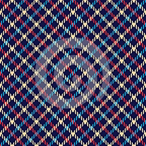 Houndstooth pattern in blue, red, beige. Colorful dark traditional abstract background texture for dress, skirt, jacket.