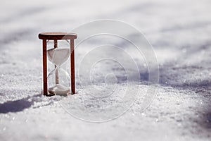 Hourglass as a symbol of change daylight saving time to winter time