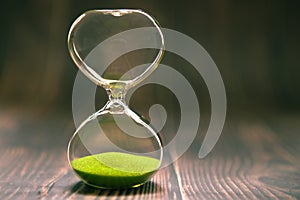 Hourglass as time passing concept for business deadline, urgency and running out of time