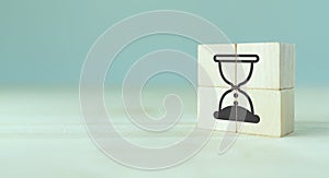 Hourglass as time passing concept for business deadline, urgency and running out of time.