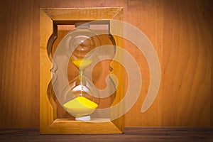 Hourglass as time passing concept for business deadline, urgency and running out of time.