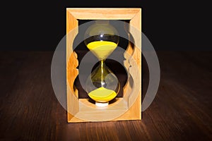 Hourglass as time passing concept for business deadline, urgency and running out of time.