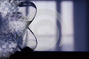 Hourglass as time passing and pass away concept.