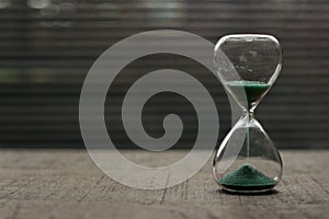 Hourglass with blue green sand