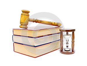 Hourglass, books and judges gavel