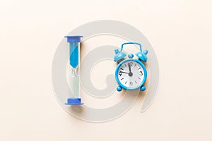 hourglass and clock as time passing concept for business deadline, urgency and running out of time