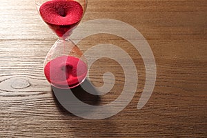 Hourglass with flowing red sand