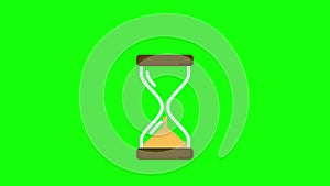 Hourglass on green background