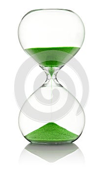 Hourglass with green sand running through