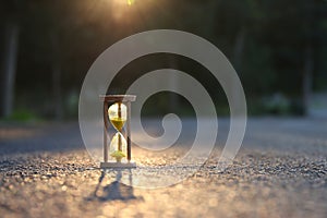 Hourglass in nature. Idea of ecology, time and preserving the earth