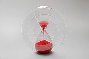 Hourglass with red sand