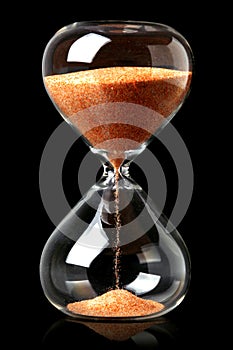 Hourglass with red sand showing the passage of time