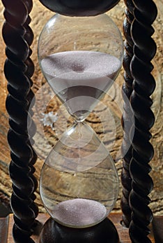 Hourglass with running white sand