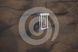 Hourglass on a sand dune beach
