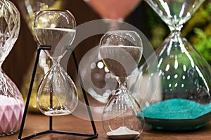 Hourglass on table in office. Time management concept.