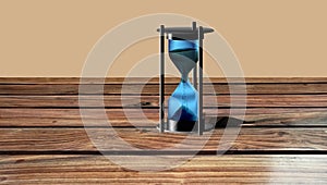 Hourglass Time Hour on a wood background with plenty of room for type.