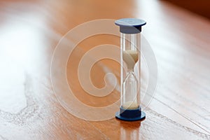 Hourglass time passing concept for business deadline.
