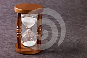 Hourglasses on a grey background