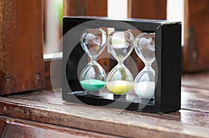 Hourglasses on the wooden cube
