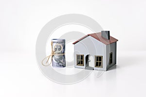 House and 100 dollars banknotes