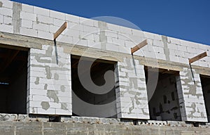 House with aerated concrete blocks and unfinished roofing construction