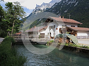 House in alpine landscape at stream idyllic domicile