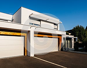 House architecture style with large garage automated door