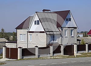 The house is with an attic and a combined roof.