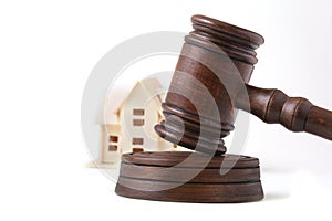 House Auction, auction hammer , symbol of authority and Miniature house . Courtroom concept.