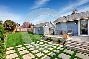 House backyard with patio area on walkout deck