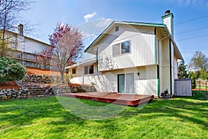 House backyard view. Wooden floor walkout deck