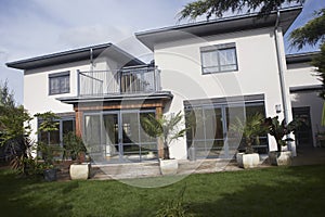 House With Balcony And Lawn