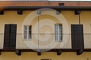 House balcony with Piedmontese railings. Old building in the courtyard of the Novara castle